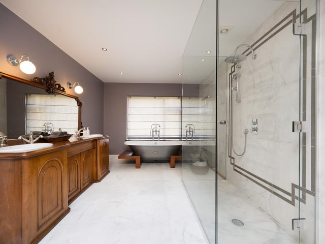 One of the luxury bathrooms, with free standing bath and walk-in shower.