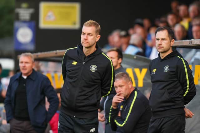 Harrogate Town manager Simon Weaver, left, and assistant boss Paul Thirlwell watch on from the sidelines.
