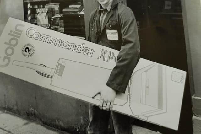 an Apprentice in 1988 outside shop on high street 
