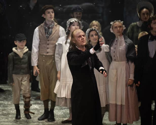 Performer Jonathan Hanks (C), playing Ebenezer Scrooge, takes part in a dress rehearsal of Northern Ballet's production of "A Christmas Carol", based on the novel by Charles Dickens, in the Lyceum Theatre in Sheffield, on November 6, 2024. (Photo by OLI SCARFF/AFP via Getty Images)