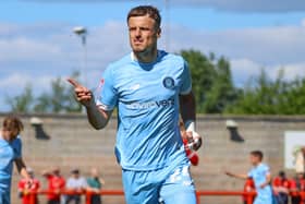 Josh March celebrates after scoring what proved to be the winning goal during Harrogate Town's 2-1 win at Morecambe. Pictures: Matt Kirkham
