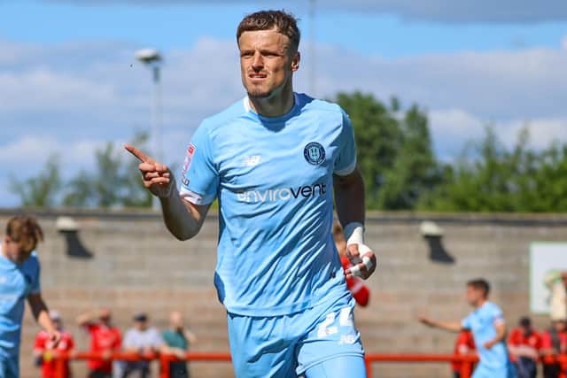 Josh March celebrates after scoring what proved to be the winning goal during Harrogate Town's 2-1 win at Morecambe. Pictures: Matt Kirkham