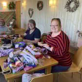 The Hookers and Clickers knitting group hard at work creating more twiddlemuffs at at Full Circle Funerals in Harrogate.