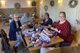 The Hookers and Clickers knitting group hard at work creating more twiddlemuffs at at Full Circle Funerals in Harrogate.