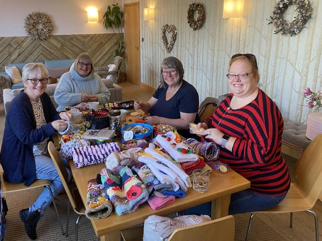 The Hookers and Clickers knitting group hard at work creating more twiddlemuffs at at Full Circle Funerals in Harrogate.