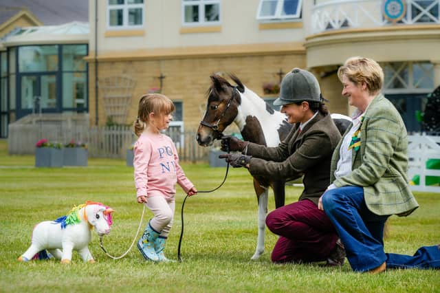 Great Yorkshire Show Director Rachel Coates (right) with British Minature Horse TLF Matisse one of the first to be shown at the Great Yorkshire Show with owner Hannah Miller and daughter Athena. (Picture contributed)
