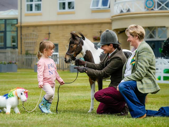Great Yorkshire Show Director Rachel Coates  (right) with British Minature Horse TLF Matisse one of the first to be shown at the Great Yorkshire Show with owner Hannah Miller and daughter Athena. (Picture contributed)