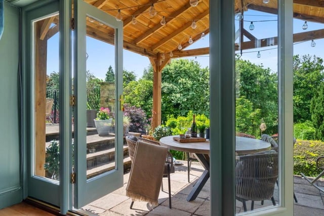 Indoor to outdoor living - a stone terrace overlooking the garden links the two.
