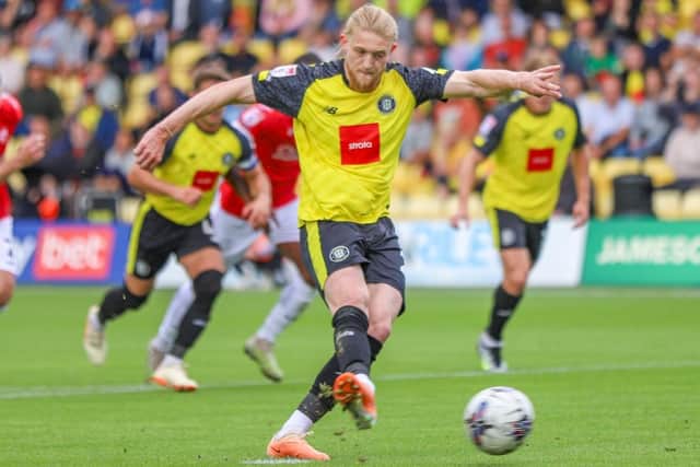Luke Armstrong remains a Harrogate Town player after his big-money move to League Two rivals Wrexham fell through.