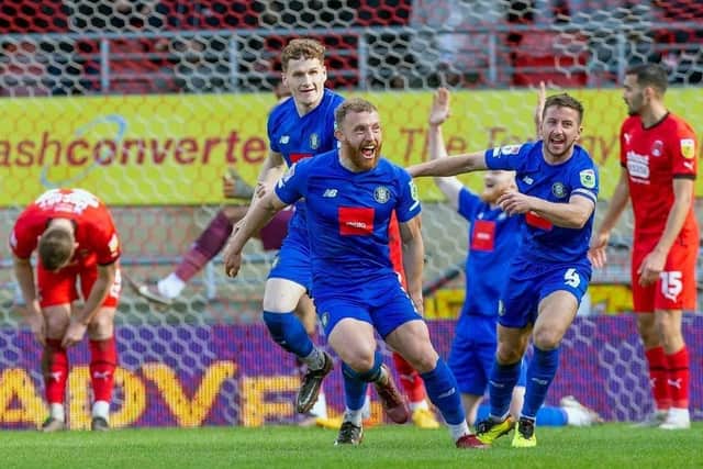 George Thomson celebrates after netting Harrogate Town's second-half equaliser at Leyton Orient. Picture: Brody Pattison