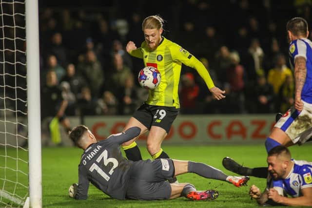 Luke Armstrong's 77th-minute goal proved to be a mere consolation for Harrogate Town as they were soundly-beaten by Colchester United at Wetherby Road.
