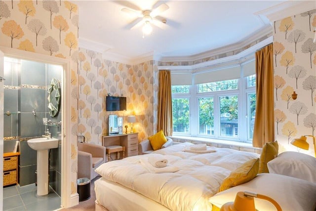 A bay-fronted double guest room with en suite.