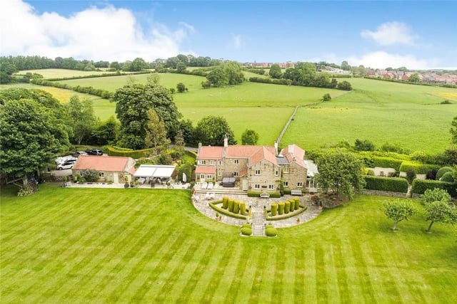 This four bedroom and four bathroom detached house is for sale with Strutt & Parker for £2,100,000
