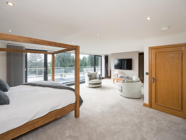 A bedroom suite with access to balconies.