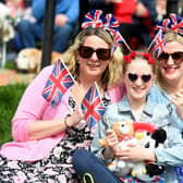 Pictured dressed in red, white and blue are Amy, Francesca and Alison Crabbe enjoying the King's Coronation.