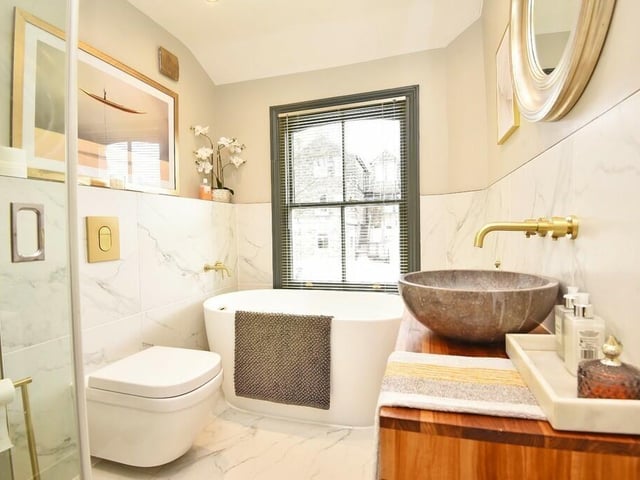 This super-stylish bathroom is on the first floor of the house.