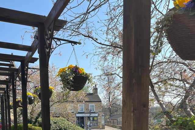 The finished repairs with the beautiful hanging baskets.