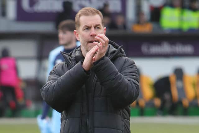 Sulphurites boss Simon Weaver applauds the travelling fans following Saturday's League Two loss in South Wales.