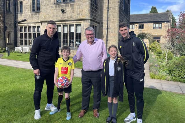 Supporting an urgent £500,000 fundraising appeal - Harrogate Town players Jack Muldoon and Mathew Foulds with Saint Michael’s CEO, Tony Collins, Tony’s grandson, and the daughter of a hospice colleague.  (Picture contributed)