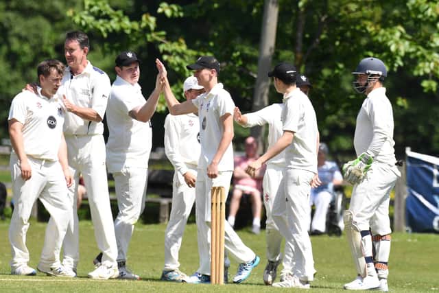Pateley Bridge players celebrate an early breakthrough during their Theakston Nidderdale League Division One clash with West Tanfield.
