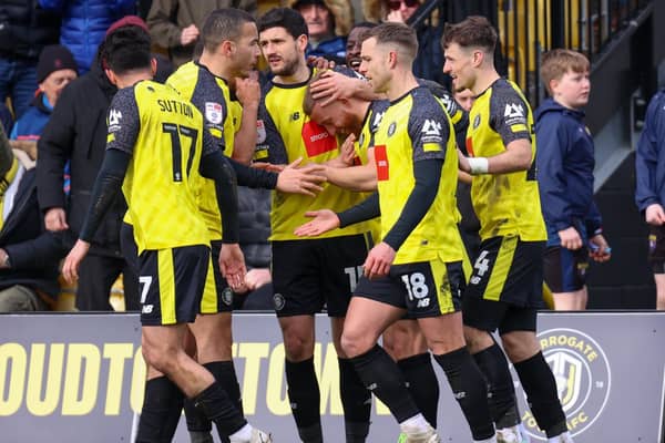 Harrogate Town players celebrate taking a two-goal lead against Bradford City at Wetherby Road. Pictures: Matt Kirkham