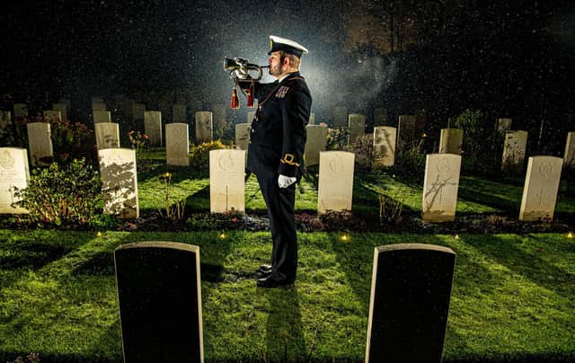 Royal Naval Reserve Dan Wilding RNR plays the last post at the Candlelit Christmas Remembrance event held at the Commonwealth War Graves Commission (CWGC) Stonefall Cemetery in Harrogate. (Picture Tony Johnson)