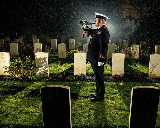 Royal Naval Reserve Dan Wilding RNR plays the last post at the Candlelit Christmas Remembrance event held at the Commonwealth War Graves Commission (CWGC) Stonefall Cemetery in Harrogate. (Picture Tony Johnson)