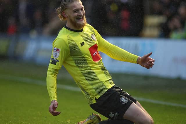 Luke Armstrong celebrates after putting Harrogate 2-0 up against Mansfield in the 19th minute of Saturday's contest.
