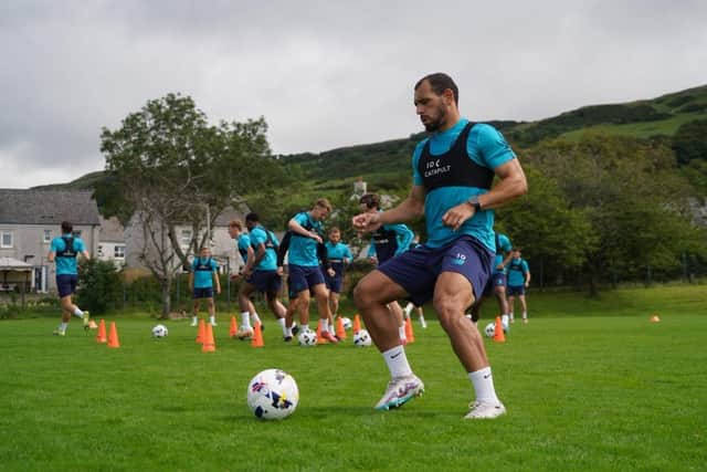 Sulphurites striker Mason Bennett gets on the ball during pre-season training in Largs, Scotland.