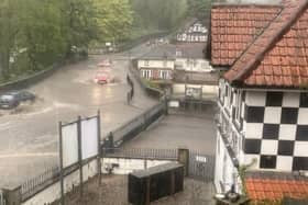 Weather nightmare - Last night's sudden storm saw the River Nidd burst its banks near the World’s End pub and Mother Shipton’s in Knaresborough with water rising onto the Low Bridge itself. (Picture contributed)