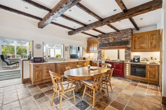 The beamed dining kitchen has burr oak handmade units, and an oil-fuelled Aga.