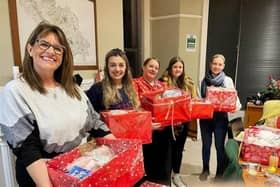 Bluebird Care Harrogate staff members, including Jessica Williams, second from left, with donations for Harrogate Women's Refuge.