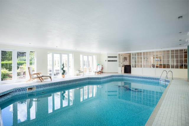 The heated indoor swimming pool within the annexe has mosaic tiling.