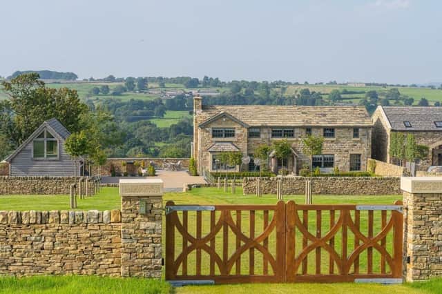 A view of the stunning property with its rural backdrop.