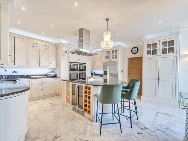 The bespoke kitchen with central island.
