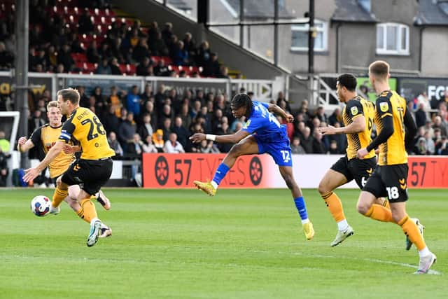 Sam Folarin fires home Harrogate Town's fifth-minute equaliser at Rodney Parade.