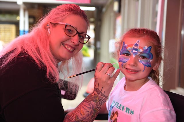 Nancy Johnson (aged six) getting her face painted at the festival by Corinna Robson of Pretty Little Faces