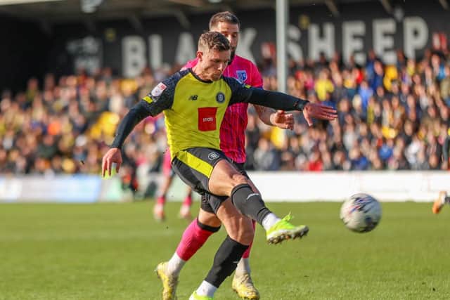 Jack Muldoon rifles home Harrogate Town's fourth goal against Gillingham.