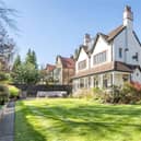 A view of the impressive Edwardian property from its lawned gardens.