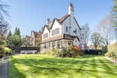 A view of the impressive Edwardian property from its lawned gardens.
