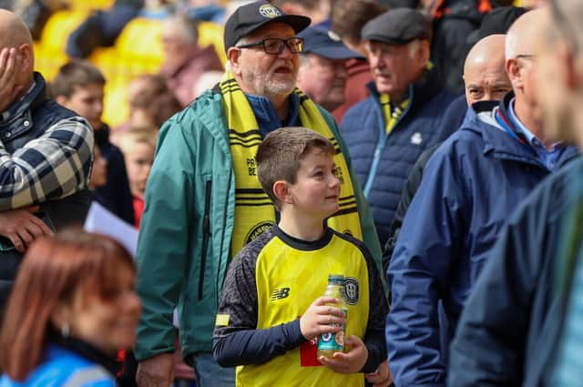 Harrogate Town supporters inside the EnviroVent Stadium. Pictures: Matt Kirkham