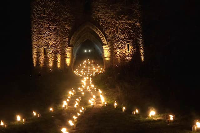 Fire Garden of real flame torches light uo the castle ruins