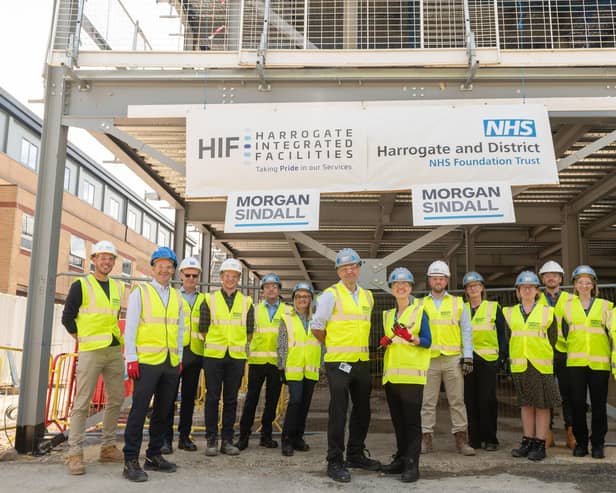 HDFT staff, construction partners and representatives from NHS Estates attend the steel signing marks major milestone for Day Case Surgery and Imaging Centre at Harrogate District Hospital. (Picture contributed)