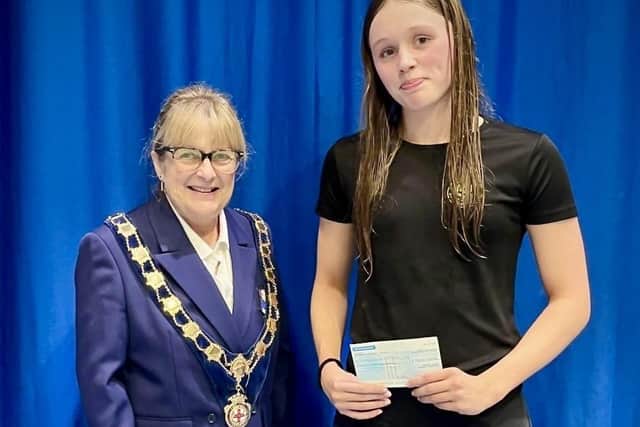 Lois Child, right, receives her scholarship from Sue Barrington, president of the Yorkshire Swimming Association.