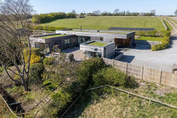 A view of the stunning eco property on the edge of Linton village, with its four acre paddock.