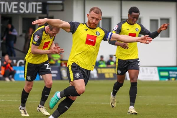 George Thomson celebrates after curling home a long-range free-kick during Harrogate Town's 5-3 home defeat to MK Dons. Pictures: Matt Kirkham