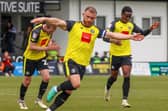 George Thomson celebrates after curling home a long-range free-kick during Harrogate Town's 5-3 home defeat to MK Dons. Pictures: Matt Kirkham