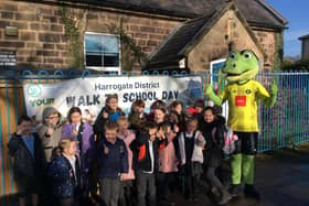 Flashback to a previous Harrogate Walk to School Day - Harry Gator from Harrogate Town greets pupils at Killinghall C Of E Primary School.