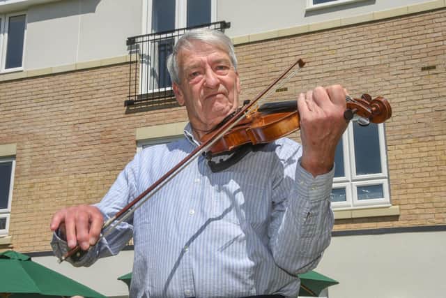John Andrew Bywater treated the home owners to a special playing of his violin.