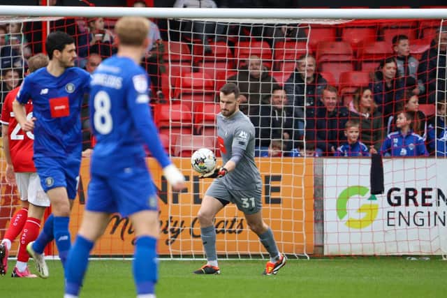 James Belshaw produced a crucial late save to help ensure that Harrogate Town left Gresty Road with a point.